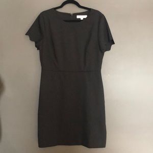 NWT Black dress with scalloped details. Size 10.